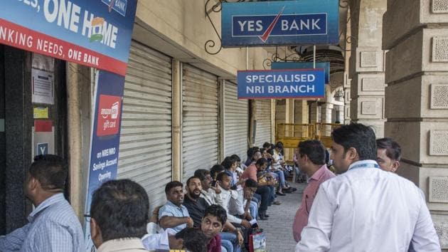 Account-holders wait outside a Yes Bank branch to withdraw their money at Fort in Mumbai, Maharashtra. The bank has been put under a moratorium by the Reserve Bank of India (RBI). (Pratik Chorge / HT Photo)