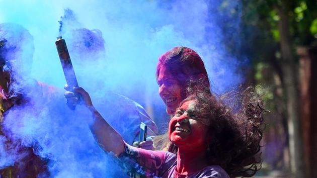 Students smear coloured powders on each other on the eve of the Hindu festival of Holi, at KG Marg in New Delhi. (Amal KS/HT PHOTO) Students smear coloured powders on each other on the eve of the Hindu festival of Holi, at KG Marg in New Delhi. (Amal KS/HT PHOTO)