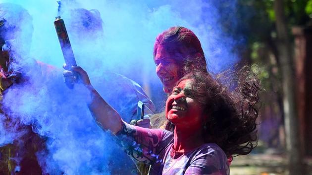 Students smear gulal on each other as part of Holi celebrations in New Delhi a day before the festival. Public transport in the national capital will be at a standstill in the morning hours owing to the festival. (Amal KS / HT Photo) Students smear gulal on each other as part of Holi celebrations in New Delhi a day before the festival. Public transport in the national capital will be at a standstill in the morning hours owing to the festival. (Amal KS / HT Photo)