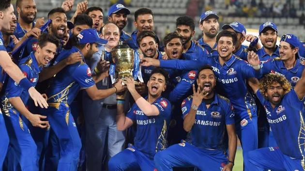 Mumbai Indians (MI) skipper Rohit Sharma with his teammates celebrating with Indian Premier League 2019 winning trophy after win over Chennai Super Kings (CSK) at the Final cricket match at Rajiv Gandhi International Cricket Stadium in Hyderabad.(PTI)