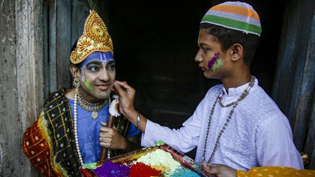 A school boy (left) dressed as the Hindu god Krishna has gulal applied to his face during celebrations of the festival in Kolkata, West Bengal. (Bikas Das / AP) A school boy (left) dressed as the Hindu god Krishna has gulal applied to his face during celebrations of the festival in Kolkata, West Bengal. (Bikas Das / AP)
