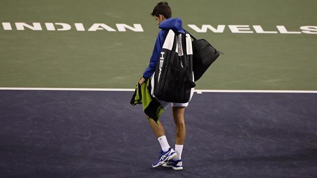 Novak Djokovic, of Serbia, walks off the court during a rain break in his match against Philipp Kohlschreiber, of Germany. (AP) Novak Djokovic, of Serbia, walks off the court during a rain break in his match against Philipp Kohlschreiber, of Germany. (AP)