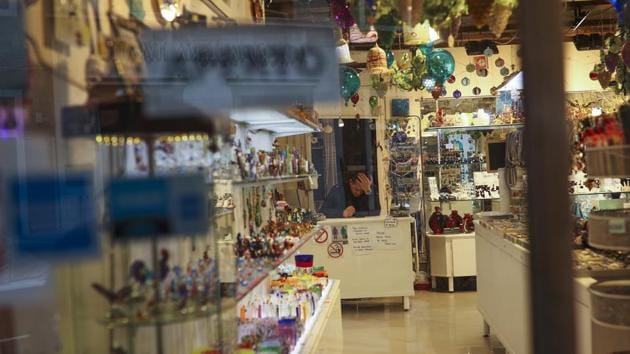 A shop assistant waits for customers at the Murano island in Venice. The head of Venice’s hotel association, Claudio Scarpa, estimated lost revenue had already reached 1 billion euros, local media reported. Nationwide, the Confturismo-Confcommercio tourist lobby estimated virus-related losses of 7.4 billion euros from March 1-May 31. (Francisco Seco / AP) A shop assistant waits for customers at the Murano island in Venice. The head of Venice’s hotel association, Claudio Scarpa, estimated lost revenue had already reached 1 billion euros, local media reported. Nationwide, the Confturismo-Confcommercio tourist lobby estimated virus-related losses of 7.4 billion euros from March 1-May 31. (Francisco Seco / AP)