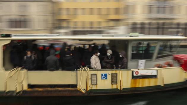 Commuters and locals ride in a bus boat. The coronavirus outbreak has hit particularly hard in Italy, where travel and tourism generate 13% of economic activity, according to the World Travel and Tourism Council. (Francisco Seco / AP) Commuters and locals ride in a bus boat. The coronavirus outbreak has hit particularly hard in Italy, where travel and tourism generate 13% of economic activity, according to the World Travel and Tourism Council. (Francisco Seco / AP)