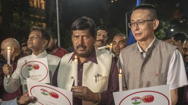 Mass prayer for the health and well-being of the Chinese people against Coronavirus by Union Minister of State For Social Justice & Empowerment Ramdas Athawale and All India Buddhist monk at Gateway of India in Mumbai, India.(Aalok Soni/HT Photo)