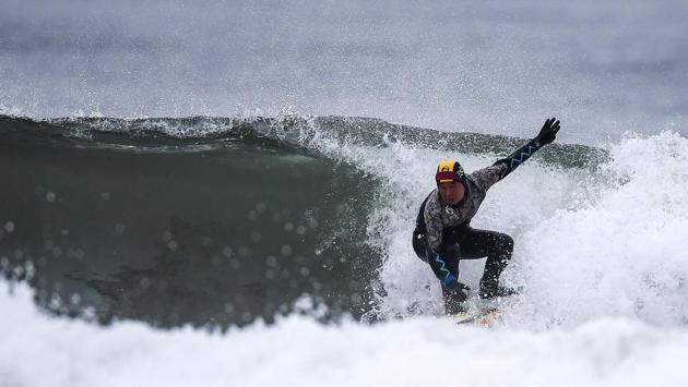 Suzuki rides a wave in Minamisoma, Fukushima prefecture. In 2011, the ruthless waves had also wiped out his entire coastal neighbourhood of some 70-strong households, including his surf shop. He fled, leaving everything behind except two shortboards that happened to be in his getaway car. (Charly Triballeau / AFP) Suzuki rides a wave in Minamisoma, Fukushima prefecture. In 2011, the ruthless waves had also wiped out his entire coastal neighbourhood of some 70-strong households, including his surf shop. He fled, leaving everything behind except two shortboards that happened to be in his getaway car. (Charly Triballeau / AFP)