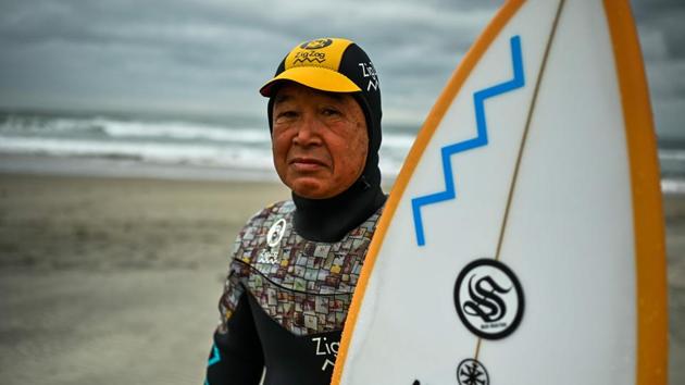 “I surf about 250 days a year,” said the veteran, emerging from the water, board under his arm. “I take a break only on New Year’s Day and the day after. The rest of the year, I come to see the ocean every morning.” Recounting the incident, he told AFP, “I lost my house, my job and my shop. My mother died while evacuated, and my father followed within months. I lost everything. Except my surfing.” (Charly Triballeau / AFP) “I surf about 250 days a year,” said the veteran, emerging from the water, board under his arm. “I take a break only on New Year’s Day and the day after. The rest of the year, I come to see the ocean every morning.” Recounting the incident, he told AFP, “I lost my house, my job and my shop. My mother died while evacuated, and my father followed within months. I lost everything. Except my surfing.” (Charly Triballeau / AFP)