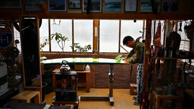 Suzuki inside his workshop. Last summer, the city of Minamisoma officially opened Suzuki’s home beach to visitors for the first time since the accident. “It was a wonderful feeling to see children frolic in the rough water of the shore. They hadn’t even tasted salty seawater until then,” he said. (Charly Triballeau / AFP) Suzuki inside his workshop. Last summer, the city of Minamisoma officially opened Suzuki’s home beach to visitors for the first time since the accident. “It was a wonderful feeling to see children frolic in the rough water of the shore. They hadn’t even tasted salty seawater until then,” he said. (Charly Triballeau / AFP)