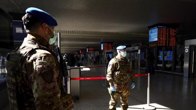 Soldiers wear mask as they monitor the travellers inside Rome’s Termini train station . “The future of Italy is in our hands. Let us all do our part, by giving up something for our collective good,” Prime Minister Giuseppe Conte said in a tweet, encouraging people to take personal responsibility amid the outbreak. (Andrew Medichini / AP) Soldiers wear mask as they monitor the travellers inside Rome’s Termini train station . “The future of Italy is in our hands. Let us all do our part, by giving up something for our collective good,” Prime Minister Giuseppe Conte said in a tweet, encouraging people to take personal responsibility amid the outbreak. (Andrew Medichini / AP)