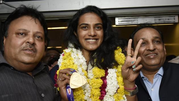 PV Sindhu arrives at the Indira Gandhi International Airport after winning the BWF Badminton World Championship. (Vipin Kumar/HT PHOTO) PV Sindhu arrives at the Indira Gandhi International Airport after winning the BWF Badminton World Championship. (Vipin Kumar/HT PHOTO)