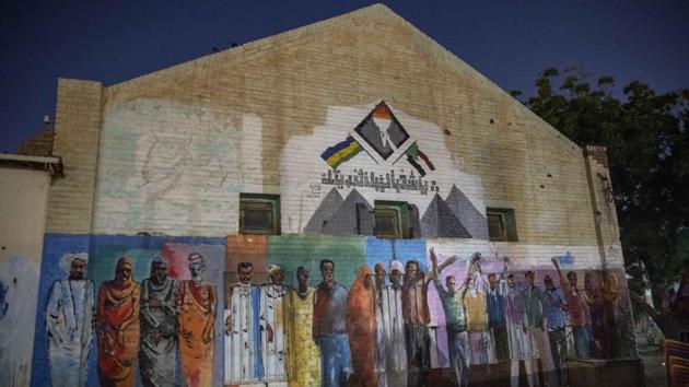 Graffiti made during last years’ revolution on a street in Khartoum, Sudan. When activist and artist Youssef al-Sewahly took to the streets in Sudan late in 2018, he and the other protesters had one goal: to remove the autocratic regime of Omar al-Bashir and replace it with a civilian-led government. They’ve achieved the former, but the latter still hangs in the balance. (Nariman El-Mofty / AP) Graffiti made during last years’ revolution on a street in Khartoum, Sudan. When activist and artist Youssef al-Sewahly took to the streets in Sudan late in 2018, he and the other protesters had one goal: to remove the autocratic regime of Omar al-Bashir and replace it with a civilian-led government. They’ve achieved the former, but the latter still hangs in the balance. (Nariman El-Mofty / AP)