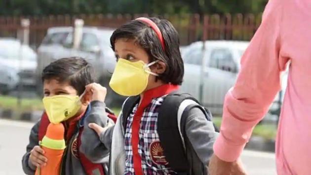 School students seen wearing protective masks as a precautionary measure against coronavirus. (HT file) School students seen wearing protective masks as a precautionary measure against coronavirus. (HT file)