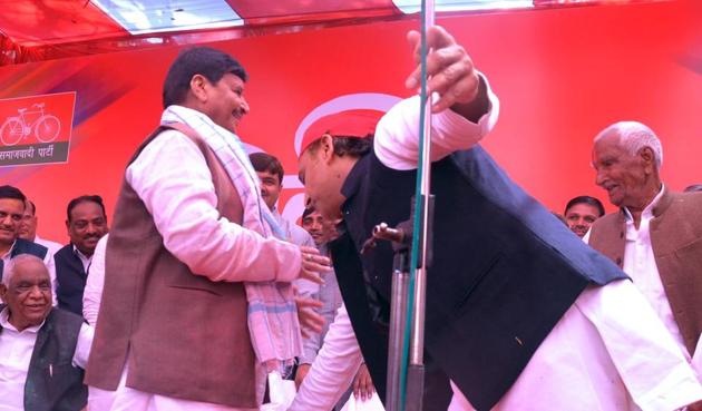 Akhilesh Yadav touching the feet of his uncle Shivpal Yadav. (Sughar Singh) Akhilesh Yadav touching the feet of his uncle Shivpal Yadav. (Sughar Singh)