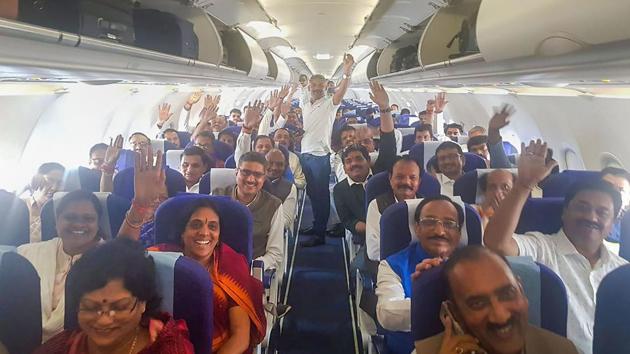 Congress MLAs react as they leave in a special flight for Jaipur from Raja Bhoj Airport in Bhopal. (PTI) Congress MLAs react as they leave in a special flight for Jaipur from Raja Bhoj Airport in Bhopal. (PTI)