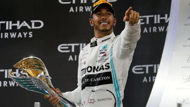Mercedes' Lewis Hamilton celebrates with a trophy after winning the race.(REUTERS) Mercedes' Lewis Hamilton celebrates with a trophy after winning the race.(REUTERS)