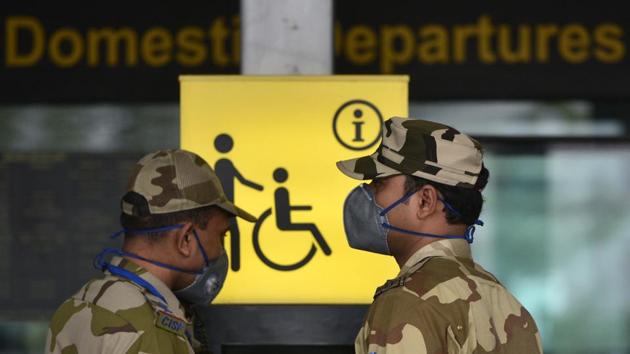 Security personnel seen wearing safety masks for prevention against coronavirus, at Netaji Subhas Chandra Bose International (NSCBI) airport.