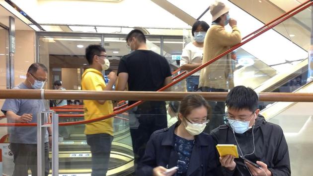 People wear face masks to protect against the spread of the coronavirus at a department store in Taipei, Taiwan, on March 7. (AP Photo) People wear face masks to protect against the spread of the coronavirus at a department store in Taipei, Taiwan, on March 7. (AP Photo)