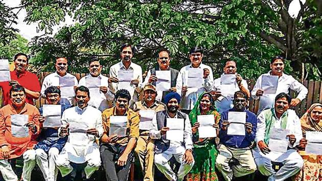 MLAs of the ruling Congress in Madhya Pradesh show their resignation letter (PTI) MLAs of the ruling Congress in Madhya Pradesh show their resignation letter (PTI)