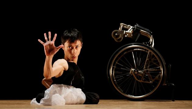 Kenta Kambara, 34, performs onstage during a dance event in Tokyo. Whirling, spinning, reaching, grasping - Japanese wheelchair dancer Kenta Kambara’s emotive performances are wordless testimony to artistic passion and possibility. Born with spina bifida, a disorder that paralysed his lower body, Kambara aims to perform at the Tokyo 2020 Paralympics opening or closing ceremonies, seeking to send a message to disabled and able-bodied people alike: it’s okay to be different. (Kim Kyung-Hoon / REUTERS) Kenta Kambara, 34, performs onstage during a dance event in Tokyo. Whirling, spinning, reaching, grasping - Japanese wheelchair dancer Kenta Kambara’s emotive performances are wordless testimony to artistic passion and possibility. Born with spina bifida, a disorder that paralysed his lower body, Kambara aims to perform at the Tokyo 2020 Paralympics opening or closing ceremonies, seeking to send a message to disabled and able-bodied people alike: it’s okay to be different. (Kim Kyung-Hoon / REUTERS)