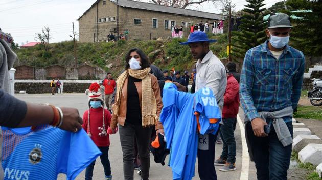 Cricket fans wearing facemasks amid concerns of the spread of the COVID-19 coronavirus arrive at the Himachal Pradesh Cricket Association Stadium in Dharamsala. (AFP) Cricket fans wearing facemasks amid concerns of the spread of the COVID-19 coronavirus arrive at the Himachal Pradesh Cricket Association Stadium in Dharamsala. (AFP)