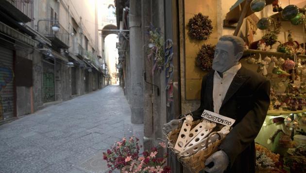 Via San Gregorio Armeno, famous for its statuettes, is empty, in downtown Naples, southern Italy, Wednesday, March 11, 2020. An existing clampdown on public gathering and basic travel has emptied streets and shuttered everything from churches to restaurants in Italy. (AP) Via San Gregorio Armeno, famous for its statuettes, is empty, in downtown Naples, southern Italy, Wednesday, March 11, 2020. An existing clampdown on public gathering and basic travel has emptied streets and shuttered everything from churches to restaurants in Italy. (AP)