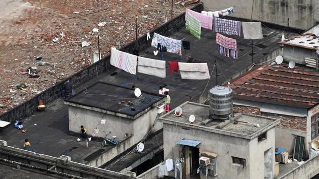 Children play football as a man gets his hair cut on the roof terrace of a building at a residential compound in Wuhan, the epicentre of the novel coronavirus disease (Covid-19) outbreak, Hubei province, China. The central Chinese city of Wuhan, where the coronavirus is believed to have originated, remains under lockdown after more than 50 days, even as the world’s attention has shifted to other hotspots. (REUTERS) Children play football as a man gets his hair cut on the roof terrace of a building at a residential compound in Wuhan, the epicentre of the novel coronavirus disease (Covid-19) outbreak, Hubei province, China. The central Chinese city of Wuhan, where the coronavirus is believed to have originated, remains under lockdown after more than 50 days, even as the world’s attention has shifted to other hotspots. (REUTERS)