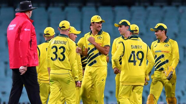 Australia's players celebrate the dismissal of New Zealand's batsman Mitchell Santner.(AFP)