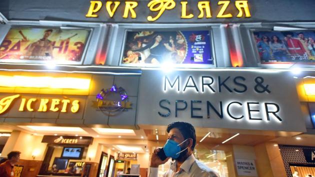 People wearing face masks as a precaution against coronavirus outside PVR Plaza cinema hall at Connaught Place. The management of several cinema halls said they had increased the frequency of housekeeping. “Disinfectants are being used for sanitising and wiping all touch points like food counter tops, box office counters, armrests, grab rails, door handles and knobs, light switches and other frequently used equipment,” said the INOX spokesperson. (Amal KS / HT Photo) People wearing face masks as a precaution against coronavirus outside PVR Plaza cinema hall at Connaught Place. The management of several cinema halls said they had increased the frequency of housekeeping. “Disinfectants are being used for sanitising and wiping all touch points like food counter tops, box office counters, armrests, grab rails, door handles and knobs, light switches and other frequently used equipment,” said the INOX spokesperson. (Amal KS / HT Photo)