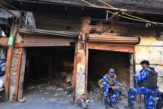 A police officer privy to the probe said on the condition of anonymity that the 14 arrested were suspected to be involved in five cases, including two murder cases, which are being probed by the SITs set up to probe riots cases.(Raj K Raj/HT PHOTO)