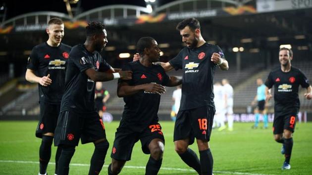Manchester United's Odion Ighalo celebrates scoring their first goal with Fred and Bruno Fernandes. (REUTERS) Manchester United's Odion Ighalo celebrates scoring their first goal with Fred and Bruno Fernandes. (REUTERS)
