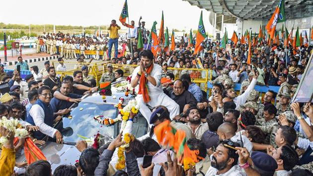 BJP leader Jyotiraditya Scindia being welcomed by his supporters on his arrival at Bhopal Airport. (PTI Photo) BJP leader Jyotiraditya Scindia being welcomed by his supporters on his arrival at Bhopal Airport. (PTI Photo)