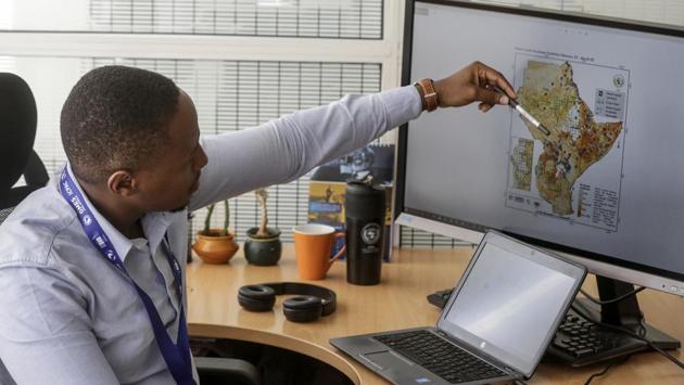 Kenneth Mwangi shows a map predicting the movement of desert locust swarms, in Nairobi. Officials said that the supercomputers will boost their efforts in tracking locust swarms. (Khalil Senosi / AP) Kenneth Mwangi shows a map predicting the movement of desert locust swarms, in Nairobi. Officials said that the supercomputers will boost their efforts in tracking locust swarms. (Khalil Senosi / AP)