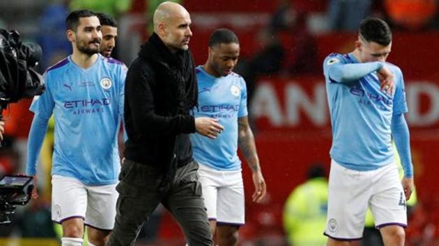 Manchester City manager Pep Guardiola and the Manchester City players look dejected after the match. (REUTERS) Manchester City manager Pep Guardiola and the Manchester City players look dejected after the match. (REUTERS)