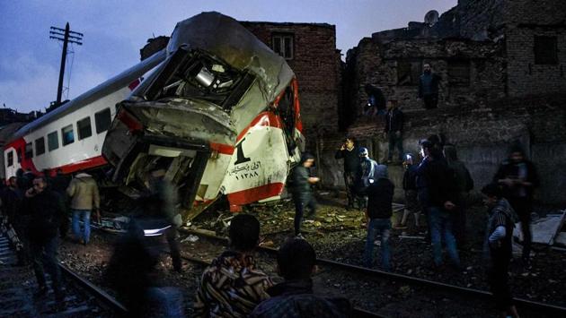 A view of the scene of a railroad collision in the Egyptian capital Cairo, where a train crashed into another which was stationary. Over a dozen were injured when two passenger trains collided , the health ministry said, triggering a suspension in nationwide rail services. (AFP) A view of the scene of a railroad collision in the Egyptian capital Cairo, where a train crashed into another which was stationary. Over a dozen were injured when two passenger trains collided , the health ministry said, triggering a suspension in nationwide rail services. (AFP)