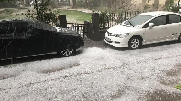 Image shows a street filled with hail. (Twitter/@abhinav97274813) Image shows a street filled with hail. (Twitter/@abhinav97274813)
