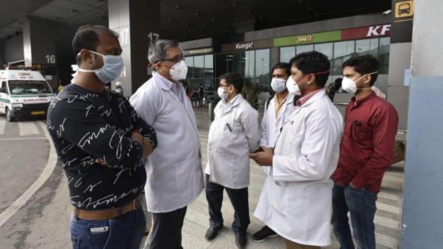 Coronavirus: Delhi government health team members at the IGI international Airport wearing masks as precaution.(Sanjeev Verma/HT Photo)