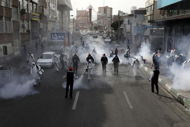 Firefighters disinfect a street against the new coronavirus, in western Tehran, Iran, Friday, March 13, 2020.(AP photo) Firefighters disinfect a street against the new coronavirus, in western Tehran, Iran, Friday, March 13, 2020.(AP photo)