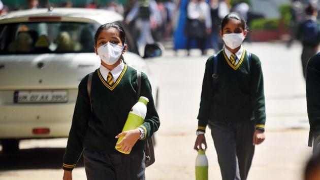 New Delhi, India - March 13, 2020: School students wearing protective masks as a precautionary measure against coronavirus, as they exit after a CBSE Board Examination at Green Park in New Delhi, India, on Friday, March 13, 2020. (Photo by Amal KS/ Hindustan Times) (Amal KS/HT PHOTO) New Delhi, India - March 13, 2020: School students wearing protective masks as a precautionary measure against coronavirus, as they exit after a CBSE Board Examination at Green Park in New Delhi, India, on Friday, March 13, 2020. (Photo by Amal KS/ Hindustan Times) (Amal KS/HT PHOTO)
