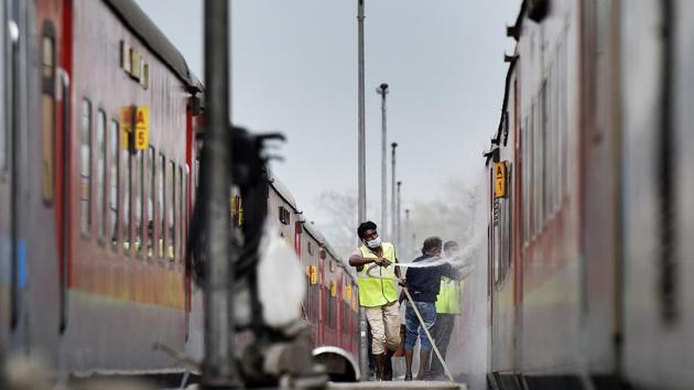 Railway cleaning staff chemically disinfect and sanitize a Rajdhani Express train as a precautionary measure in view of coronavirus concerns, at Railway Yard Ajmeri Gate, in New Delhi. India has so far reported 83 confirmed cases of the virus with two deaths. (Sonu Mehta / HT Photo) Railway cleaning staff chemically disinfect and sanitize a Rajdhani Express train as a precautionary measure in view of coronavirus concerns, at Railway Yard Ajmeri Gate, in New Delhi. India has so far reported 83 confirmed cases of the virus with two deaths. (Sonu Mehta / HT Photo)