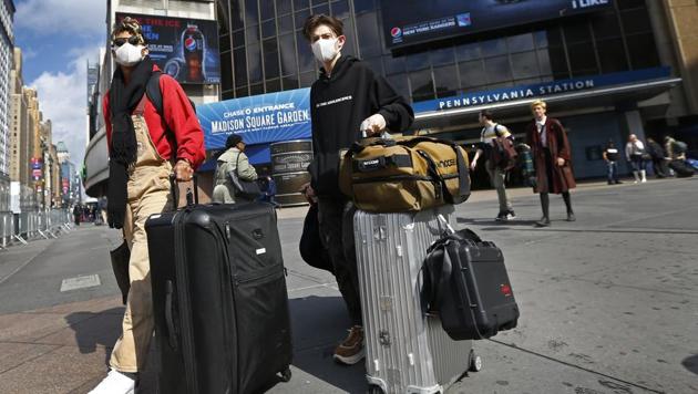 Bard College students Brent Smith and Griffin Gluck exit Penn Station on their way to the airport for a flight back home to Los Angeles because of concerns about the Covid 19 coronavirus. (USA TODAY Sports) Bard College students Brent Smith and Griffin Gluck exit Penn Station on their way to the airport for a flight back home to Los Angeles because of concerns about the Covid 19 coronavirus. (USA TODAY Sports)