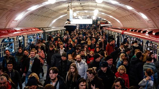 Commuters walk on the platform at Biblioteka Imeni Lenina metro station in Moscow on March 10, 2020, during evening rush hour. (AFP) Commuters walk on the platform at Biblioteka Imeni Lenina metro station in Moscow on March 10, 2020, during evening rush hour. (AFP)