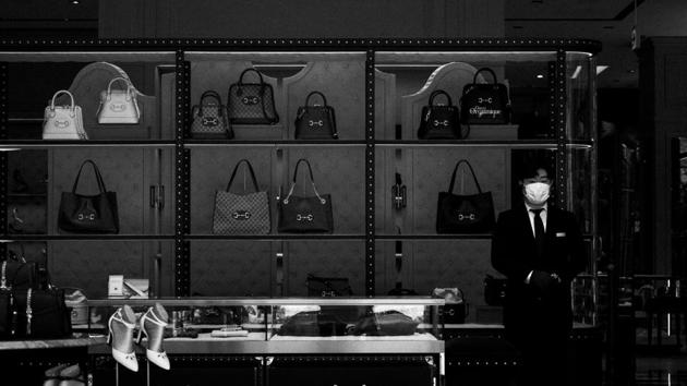A luxurious department store in the Ginza shopping district put out an apologetic notice on its cosmetics floor saying that their employees are not allowed to touch customers as a precautionary measure to prevent the spread of the virus. (Jae C Hong / AP) A luxurious department store in the Ginza shopping district put out an apologetic notice on its cosmetics floor saying that their employees are not allowed to touch customers as a precautionary measure to prevent the spread of the virus. (Jae C Hong / AP)