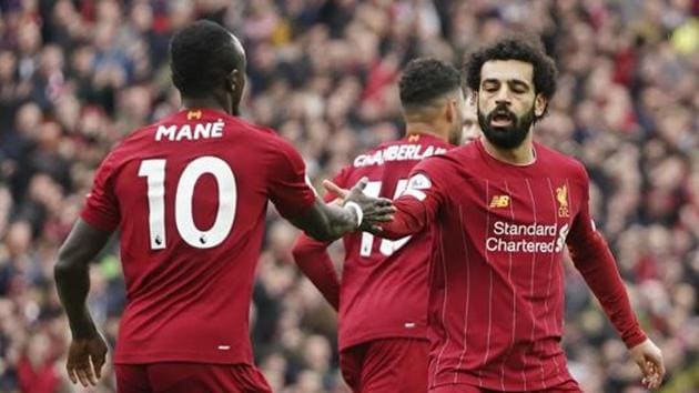 Liverpool's Mohamed Salah, right, celebrates with his teammate Sadio Mane after scoring his side's opening goal. (AP) Liverpool's Mohamed Salah, right, celebrates with his teammate Sadio Mane after scoring his side's opening goal. (AP)
