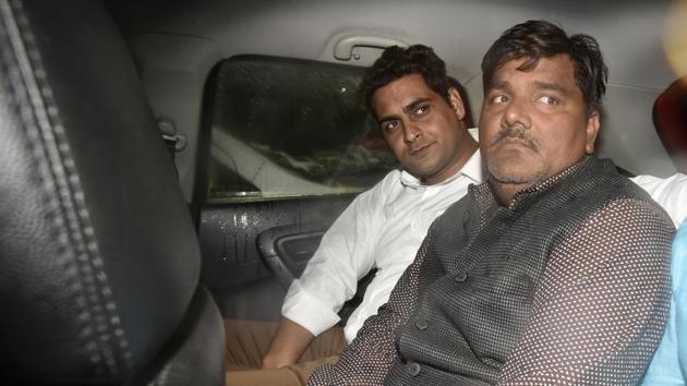 Suspended Aam Aadmi Party (AAP) councillor Tahir Hussain (centre), who is already in police custody in connection with a case of rioting, is now being interrogated to ascertain his involvement in the IB staffer’s murder, the police added. (Sanjeev Verma/HT PHOTO) Suspended Aam Aadmi Party (AAP) councillor Tahir Hussain (centre), who is already in police custody in connection with a case of rioting, is now being interrogated to ascertain his involvement in the IB staffer’s murder, the police added. (Sanjeev Verma/HT PHOTO)