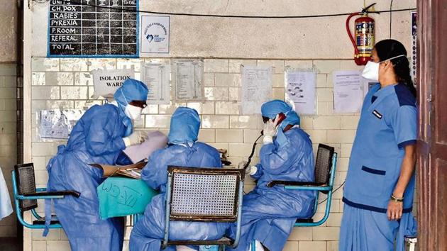 Health officials outside an isolation ward at a hospital in Hyderabad on March 13.(PTI image)