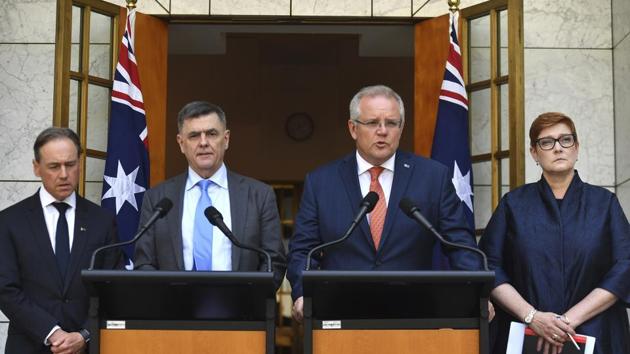 Australian Prime Minister Scott Morrison, second right, Minister for Health Greg Hunt, left, Chief Medical Officer Professor Brendan Murphy, and Minister for Foreign Affairs Marise Payne, right, give an update on the coronavirus at a press conference at Parliament House in Canberra. (AP) Australian Prime Minister Scott Morrison, second right, Minister for Health Greg Hunt, left, Chief Medical Officer Professor Brendan Murphy, and Minister for Foreign Affairs Marise Payne, right, give an update on the coronavirus at a press conference at Parliament House in Canberra. (AP)