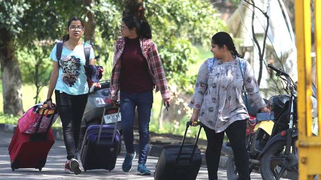 Students of Government Home Science College, Sector 10, Chandigarh, leaving their hostels on Sunday.(Keshav Singh/HT)