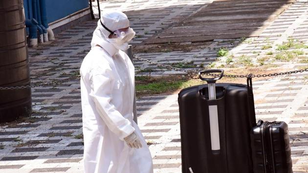 Coronavirus Outbreak: A medical staff wears a full safety dress outside the isolation ward of coronavirus patients, at Aluva government general hospital, in Kochi on Sunday.(ANI)