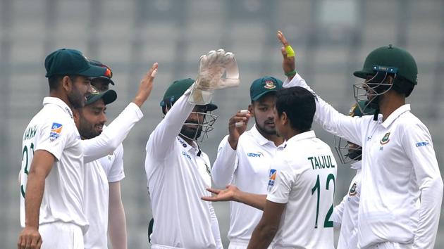 Bangladeshi cricketers celebrate.(AFP)