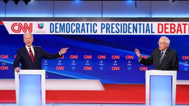 Democratic US presidential candidates former Vice President Joe Biden and Senator Bernie Sanders debate during the 11th Democratic candidates debate of the 2020 US presidential campaign, held in CNN's Washington studios. (REUTERS) Democratic US presidential candidates former Vice President Joe Biden and Senator Bernie Sanders debate during the 11th Democratic candidates debate of the 2020 US presidential campaign, held in CNN's Washington studios. (REUTERS)